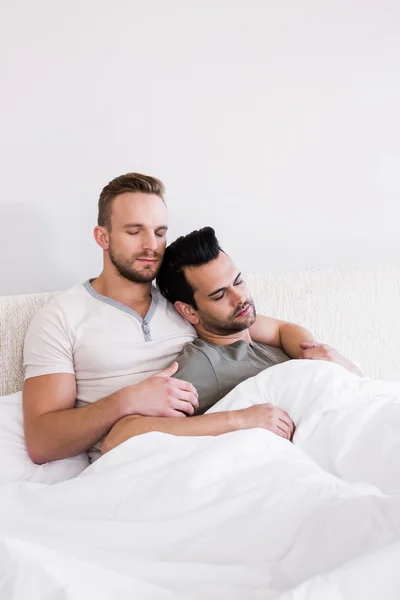 Asleep gay couple lying in bed — Stock Photo, Image