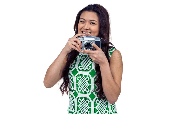 Asian woman holding digital camera — Stock Photo, Image
