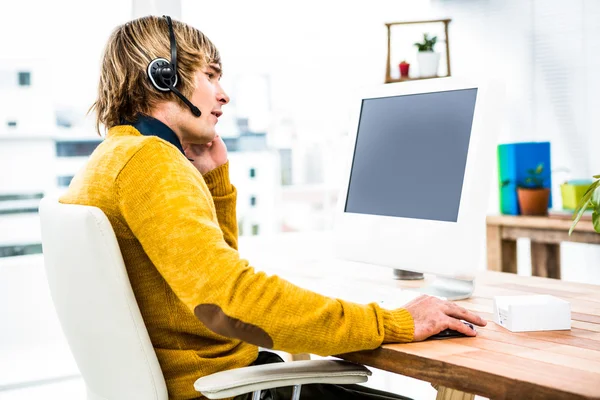 Hipster businessman using headset — Stock Photo, Image