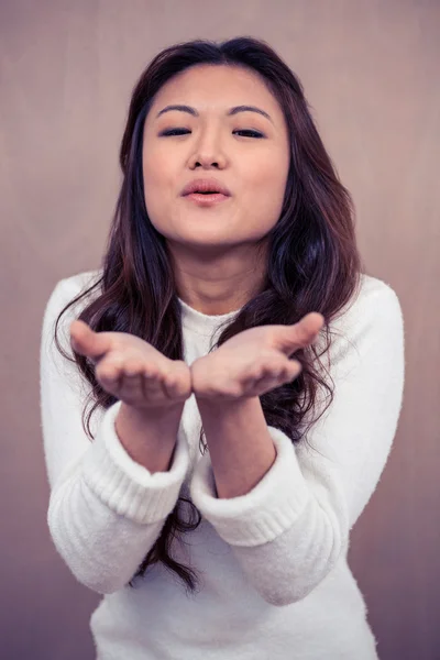 Asian woman blowing kiss — Stock Photo, Image