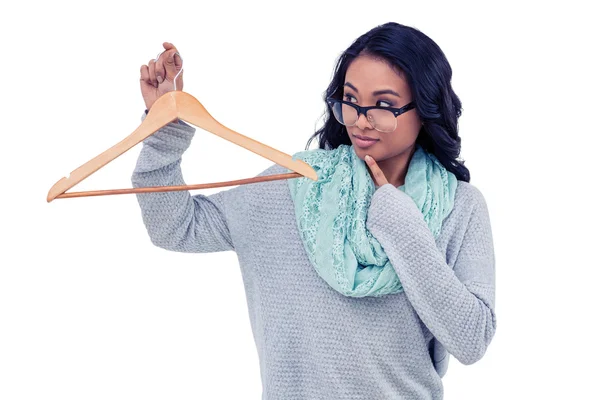 Asian woman holding wooden hanger — Stock Photo, Image