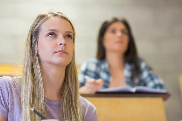 Students sitting beside each other — Stockfoto