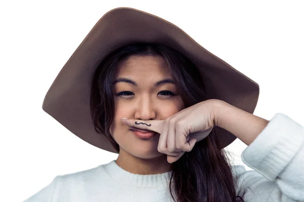 Mulher asiática com bigode no dedo — Fotografia de Stock
