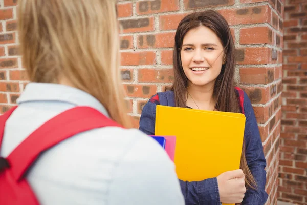 Smiling students talking outdoor — Stock Photo, Image