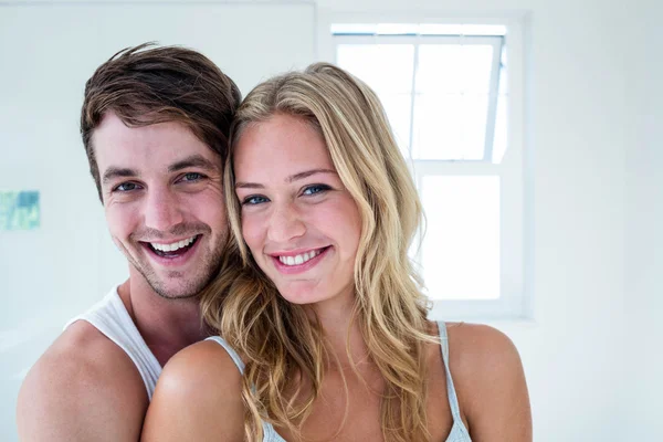 Happy couple hugging at home — Stock Photo, Image