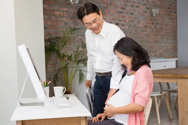 Couple touching pregnant belly — Stock Photo, Image
