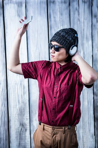 Hipster listening music with headphone — Stock Photo, Image