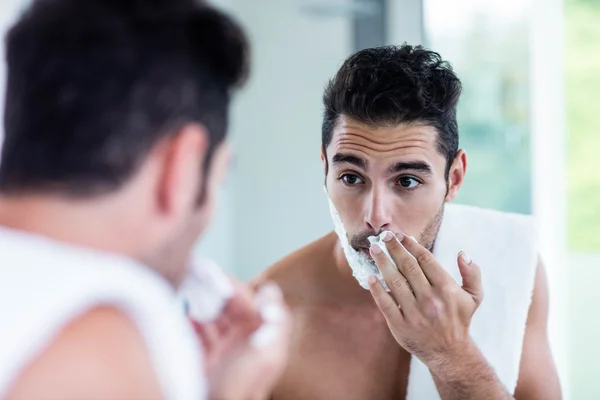 Handsome man shaving beard — Stock Photo, Image