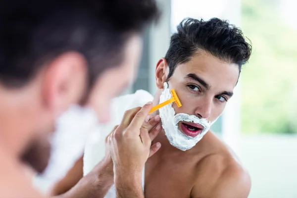 Handsome man shaving beard — Stock Photo, Image