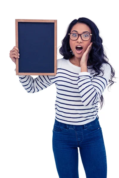 Surprised Asian woman holding blackboard — Stock Photo, Image