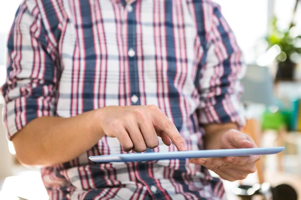 Hipster businessman using tablet — Stock Photo, Image