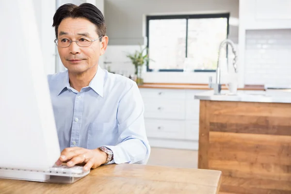 Concentrated man using computer — Stock Photo, Image