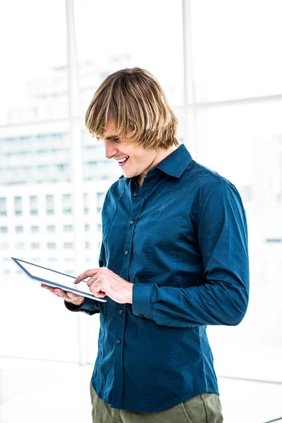 Hipster businessman using tablet — Stock Photo, Image