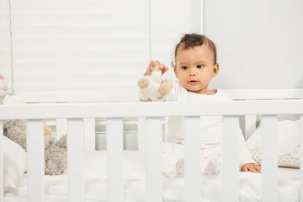 Cute baby playing with plush — Stock Photo, Image