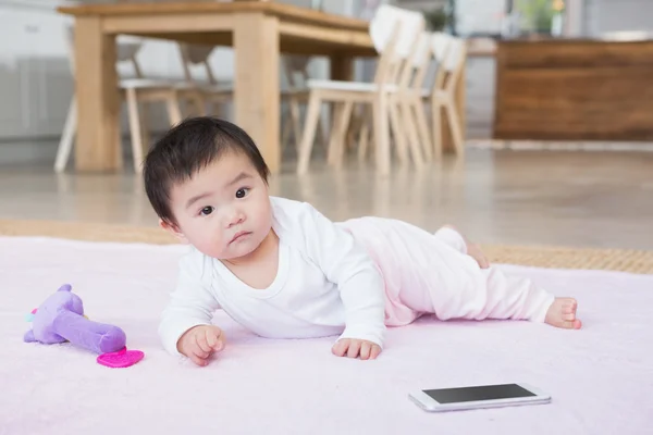 Cute baby on carpet — Stockfoto