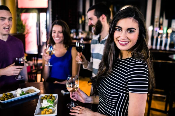 Woman having an aperitif with friends — Stock Photo, Image