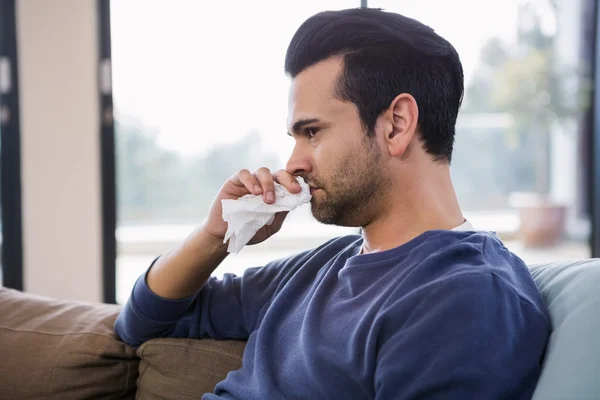 Handsome man sneezing — Stock Photo, Image