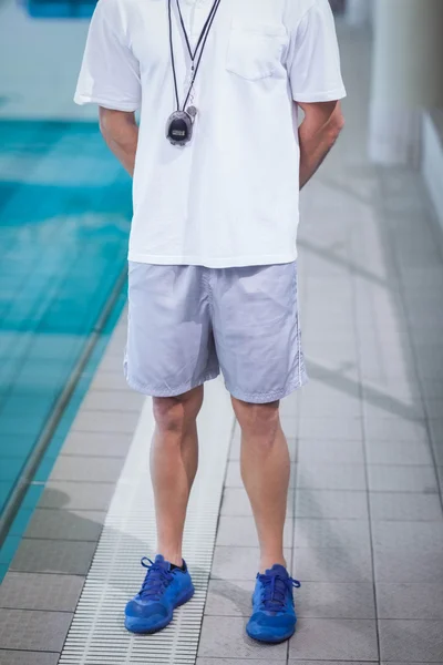 Handsome trainer holding stopwatch — Stock Photo, Image