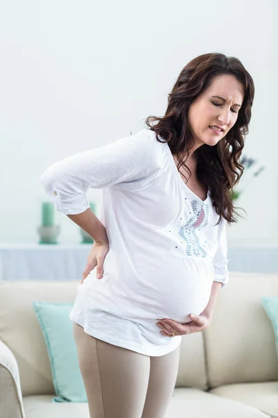 Zwangere vrouw met pijnlijke rug — Stockfoto