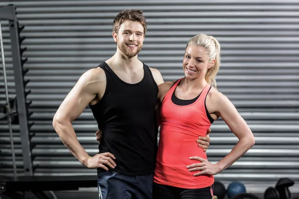 Happy fit couple embracing — Stock Photo, Image