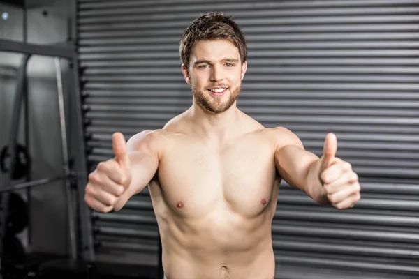 Shirtless fit man with thumbs up — Stock Photo, Image