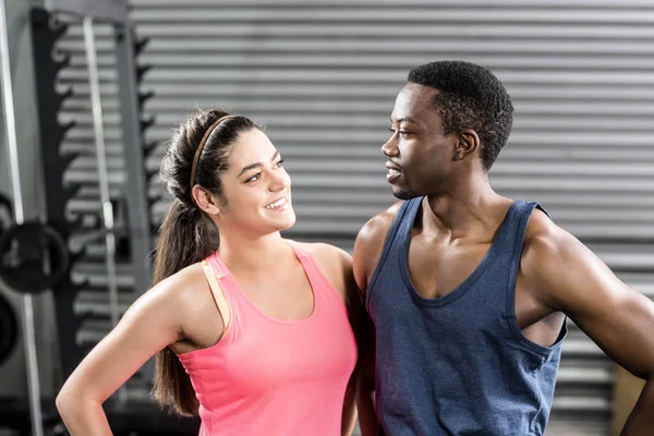 Smiling fit couple embracing — Stock Photo, Image