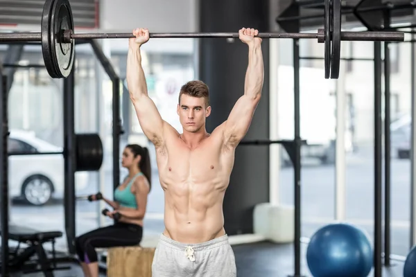 Fit couple lifting dumbbells — Stock Photo, Image