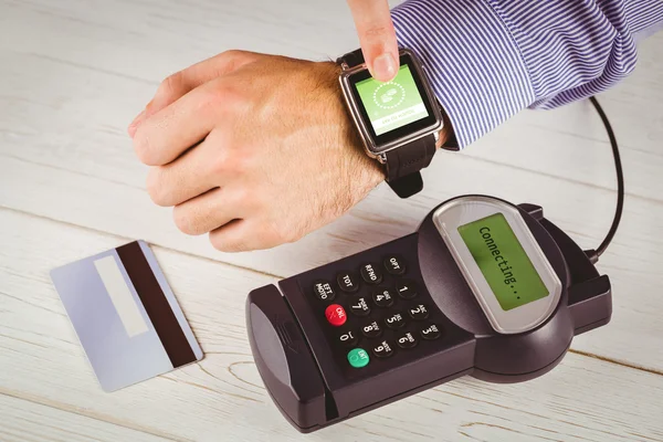 Man using smart watch to express pay — Stock Photo, Image