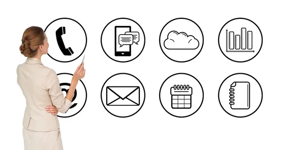 Thinking businesswoman against app icons — Stock Photo, Image