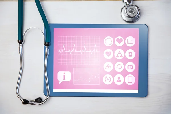 Tablet and stethoscope on desk — Stock Photo, Image