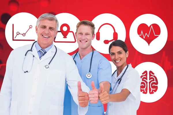 Smiling doctors with thumbs up — Stock Photo, Image