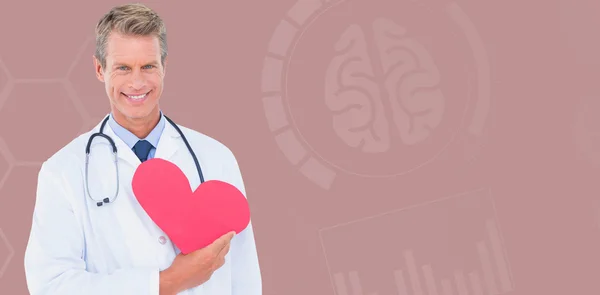 Médico segurando cartão de forma de coração — Fotografia de Stock
