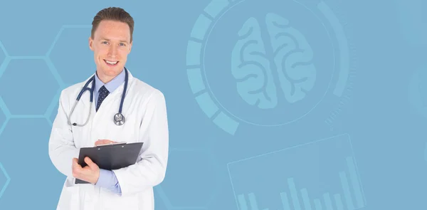 Smiling male doctor writing on clipboard — Stock Photo, Image