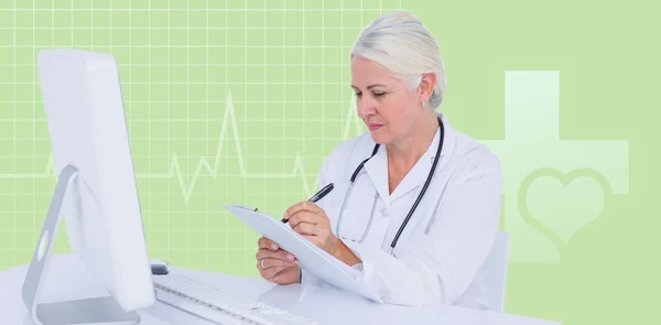 Composite image of female doctor writing on clipboard while sitt — Stock Photo, Image