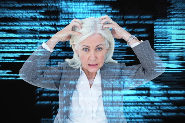 Stressed businesswoman with hands on head — Stock Photo, Image