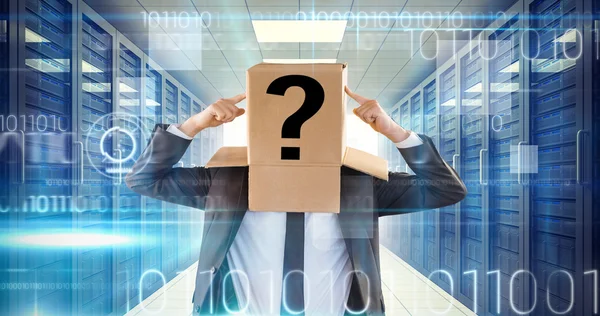 Anonymous businessman pointing to box — Stock Photo, Image