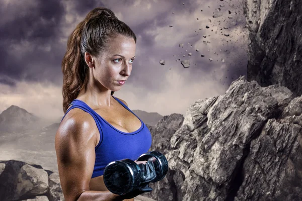 Fit woman lifting dumbbell — Stock Photo, Image