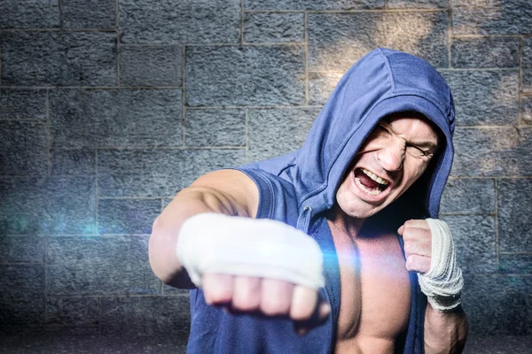 Aggressive fighter punching — Stock Photo, Image