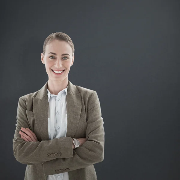 Businesswoman standing arms crossed — Stock Photo, Image