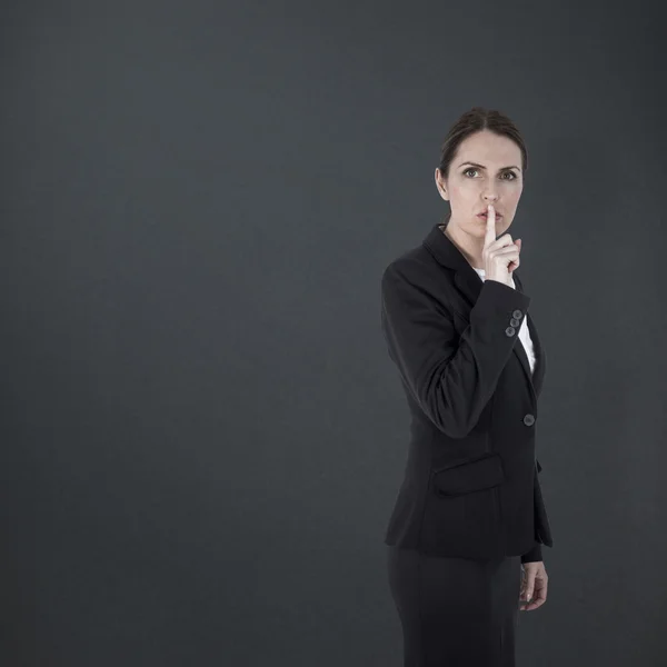 Businesswoman asking for silence — Stock Photo, Image