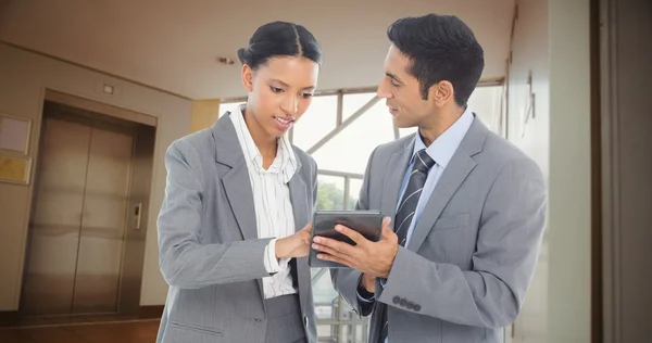 Business people discussing over tablet — Stock Photo, Image