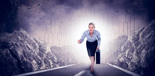 Businesswoman running and holding briefcase — Stock Photo, Image