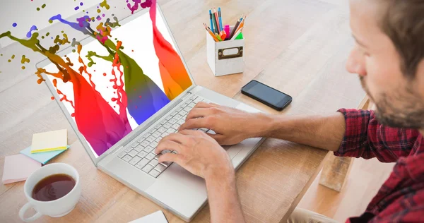 Creative businessman typing on laptop — Stock Photo, Image