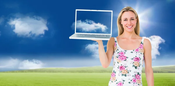 Blonde holding laptop and posing — Stock Photo, Image