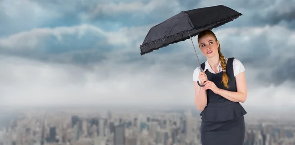 Redhead businesswoman holding umbrella — Stock Photo, Image