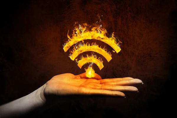 Hand showing wifi sign in fire — Stock Photo, Image