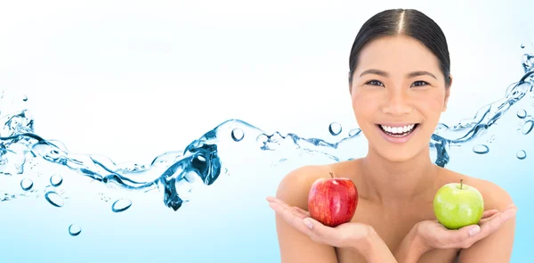 Natural brunette holding apples — Stock Photo, Image