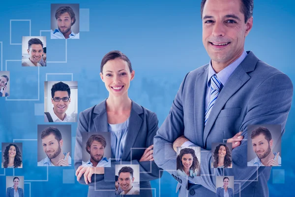 Composite image of business colleagues smiling at camera — Stock Photo, Image