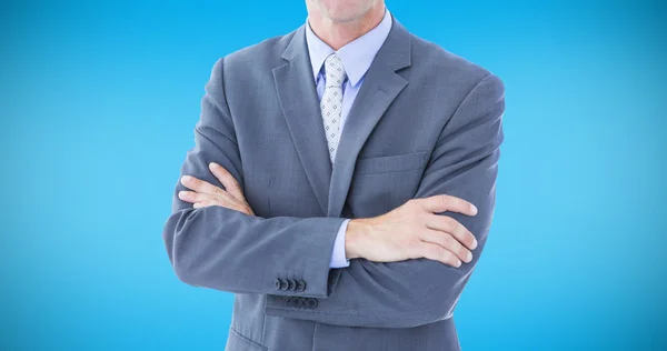 Businessman standing hands folded — Stock Photo, Image