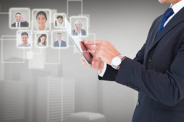 Businessman in suit using digital tablet — Stock Photo, Image